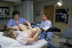 A Mother's Legs May Be Put into Stirrups During Emergency Intervention.