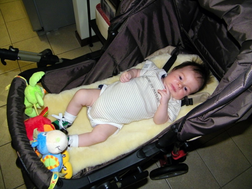 Addison in his Pram with his New Pram Toys