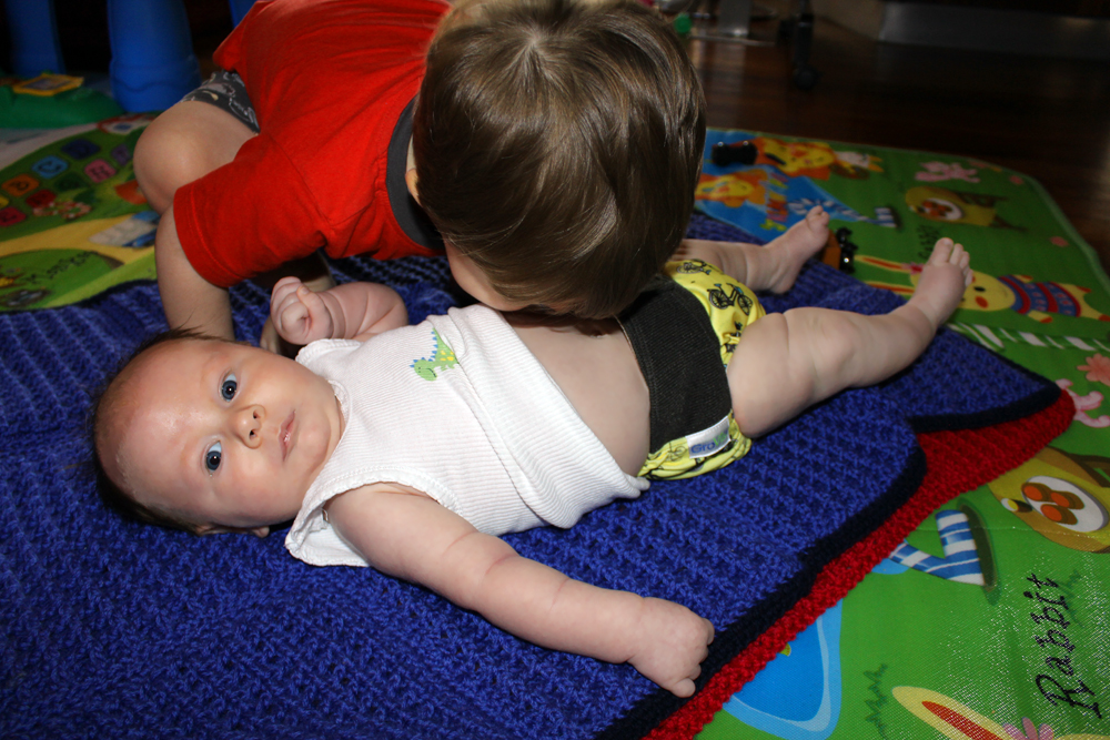 Addi Blowing Raspberries on Preston's Tummy